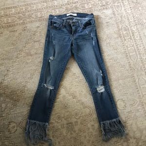 Jeans with fringe bottoms